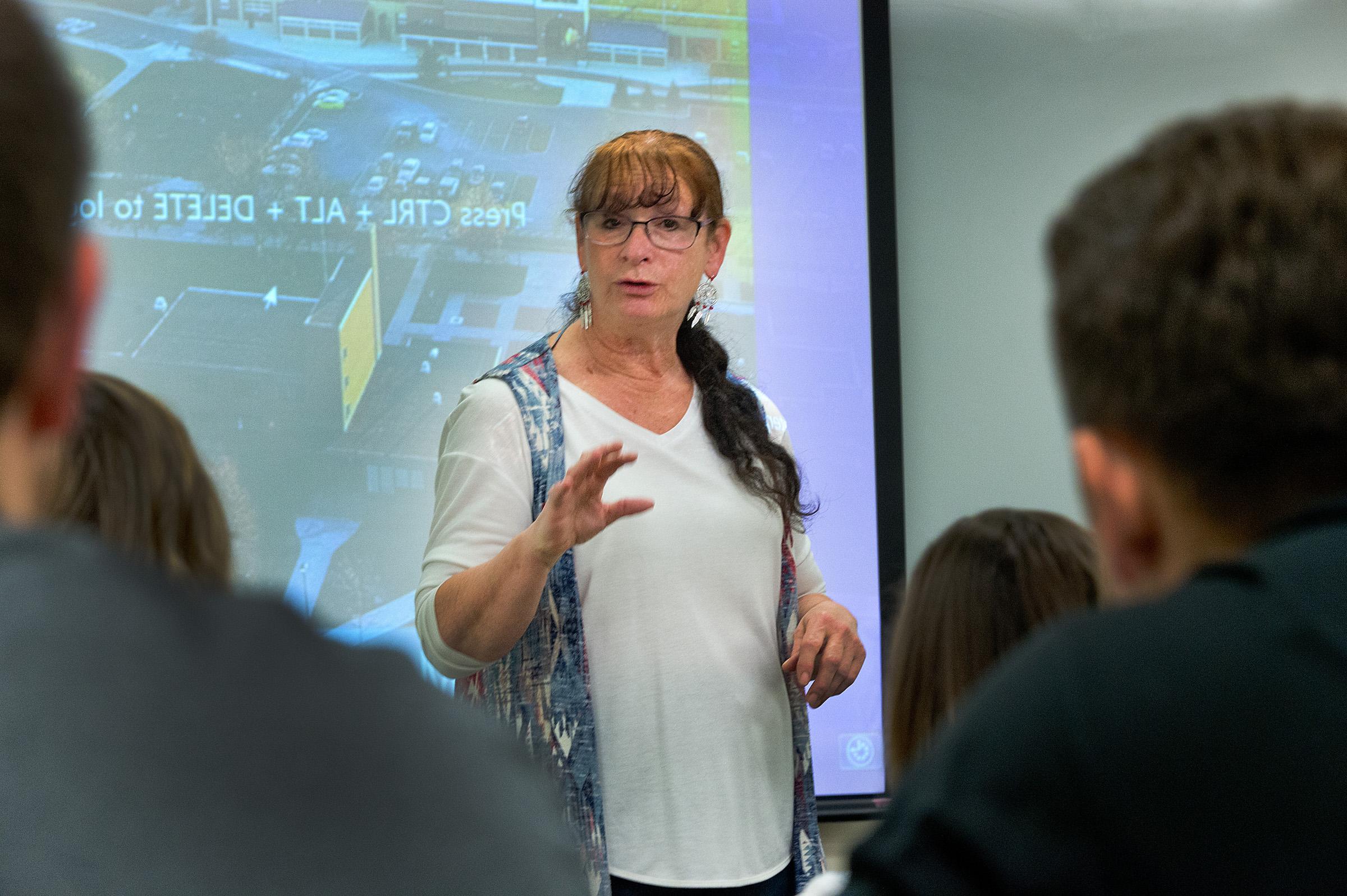 Theresa Davis lecturing students in a classroom 